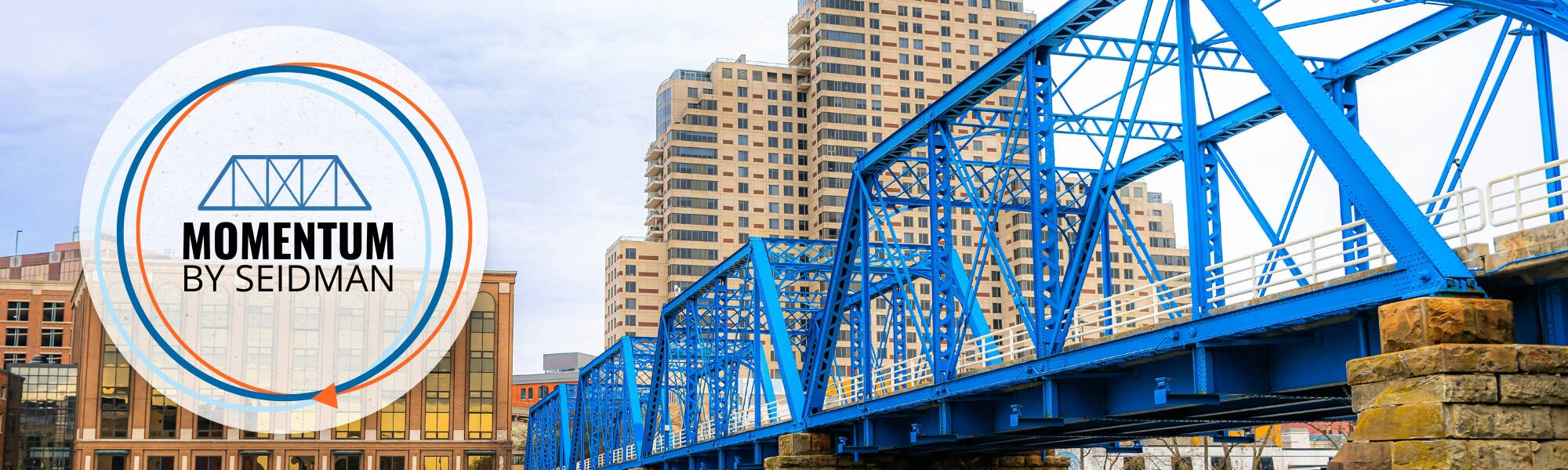 Momentum by Seidman Logo with blue bridge